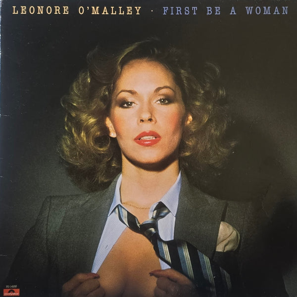 Leonore O'Malley – First Be A Woman