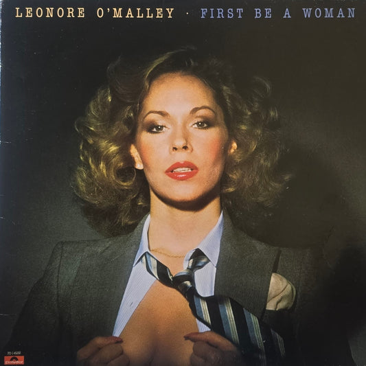 Leonore O'Malley – First Be A Woman